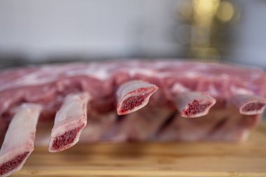 Take the Frenched veal rack out of the fridge.