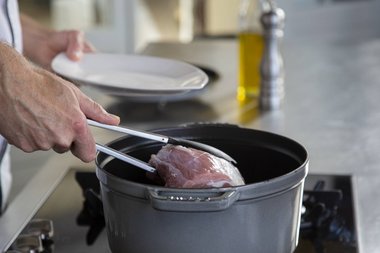 Put the veal ribeye in the pan.