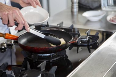 Put the butter in the pan.