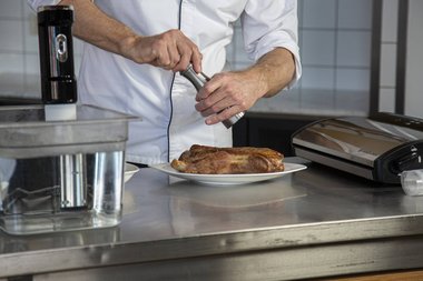 Season the veal with herbs and spices.