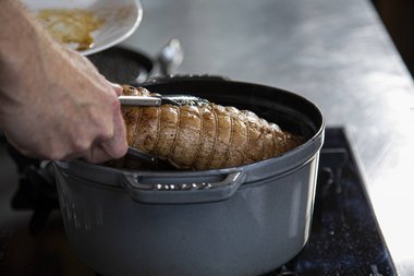 Put the veal roulade back in the pan.
