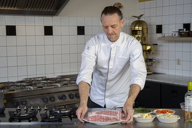 Take the veal roulade out of the fridge.