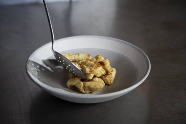 Spoon the veal strips onto a plate.